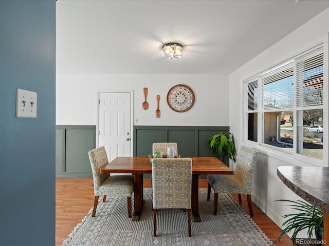 dining space featuring wood finished floors