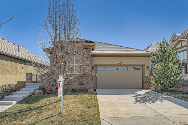 12114 Alcott St, Westminster, CO 80234 - view of front of house with driveway, an attached garage, brick siding, stucco siding, and a tile roof