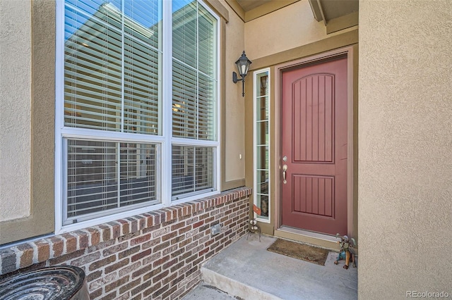 12114 Alcott St, Westminster, CO 80234 - property entrance featuring stucco siding and brick siding