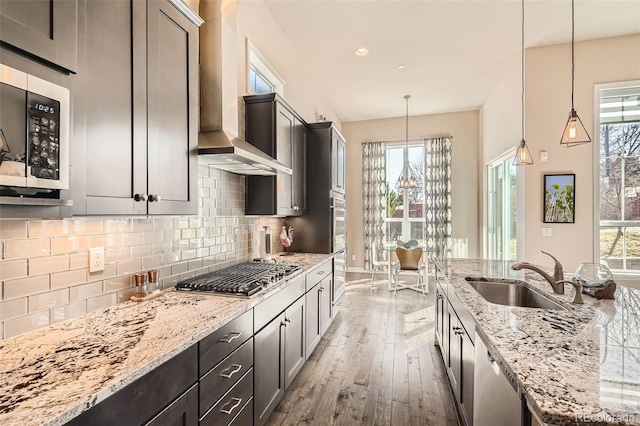 12114 Alcott St, Westminster, CO 80234 - kitchen featuring a sink, appliances with stainless steel finishes, hardwood / wood-style floors, healthy amount of natural light, and recessed lighting