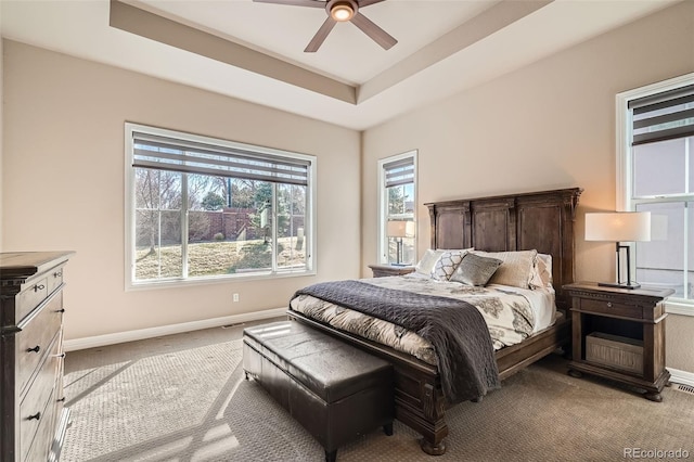 12114 Alcott St, Westminster, CO 80234 - carpeted bedroom featuring baseboards, a raised ceiling, and a ceiling fan