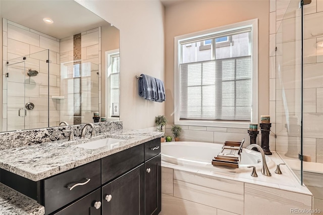 12114 Alcott St, Westminster, CO 80234 - bathroom featuring a shower stall, a bath, and vanity