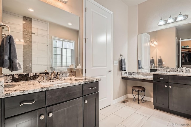 12114 Alcott St, Westminster, CO 80234 - bathroom with a shower stall, vanity, baseboards, and recessed lighting
