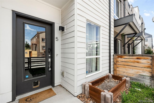 doorway to property with fence