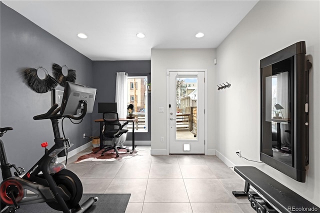 exercise room with recessed lighting, baseboards, and light tile patterned floors