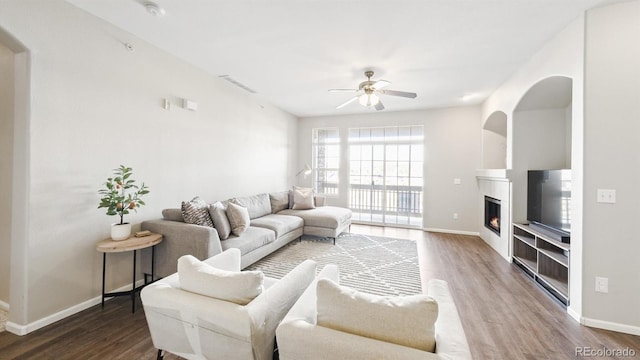 living room with hardwood / wood-style floors and ceiling fan