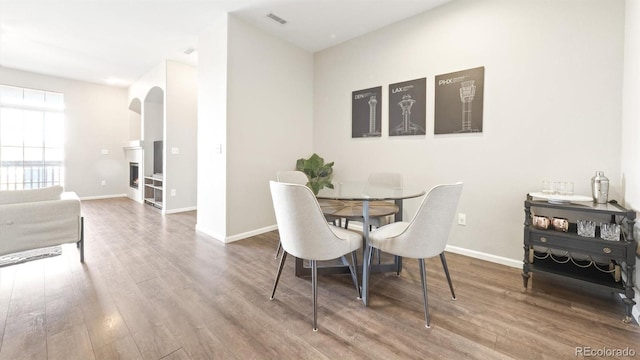 dining area featuring wood-type flooring