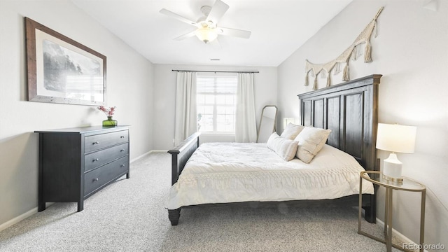 bedroom featuring light carpet and ceiling fan