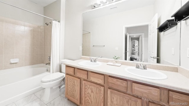 full bathroom with shower / bath combination with curtain, vanity, and toilet