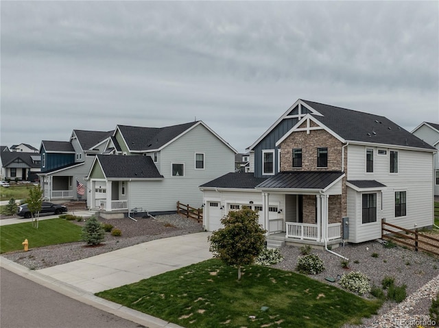 1143 Williams Loop, Elizabeth, CO 80107 - view of front of house with covered porch, driveway, a standing seam roof, a residential view, and metal roof