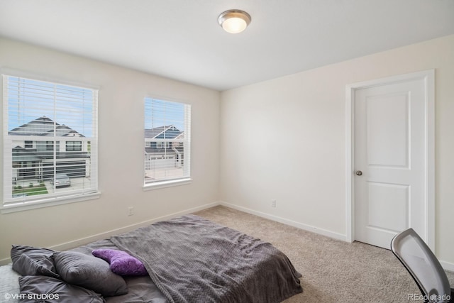 1143 Williams Loop, Elizabeth, CO 80107 - bedroom with baseboards and light colored carpet
