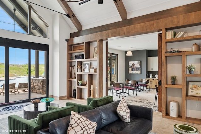 1143 Williams Loop, Elizabeth, CO 80107 - living area with beam ceiling, high vaulted ceiling, built in features, and a barn door