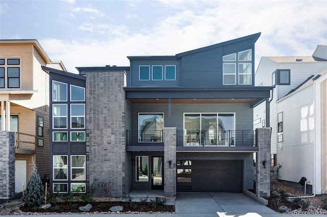 modern home with a balcony and a garage