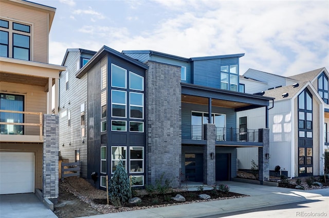 view of front of home with a balcony and a garage