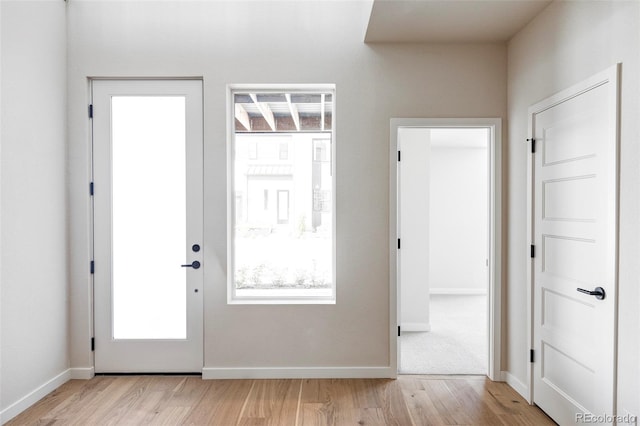 doorway with light hardwood / wood-style floors