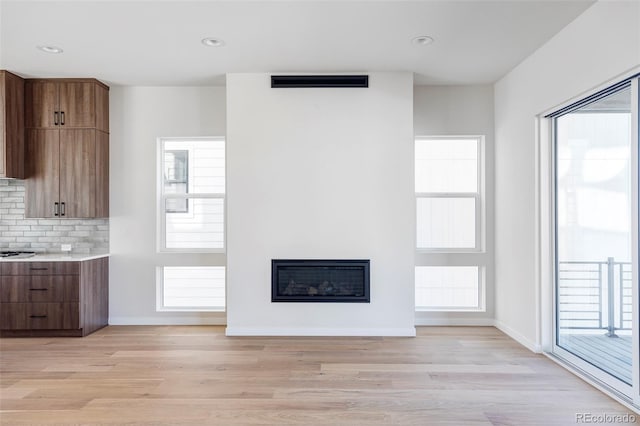 unfurnished living room featuring light wood-type flooring