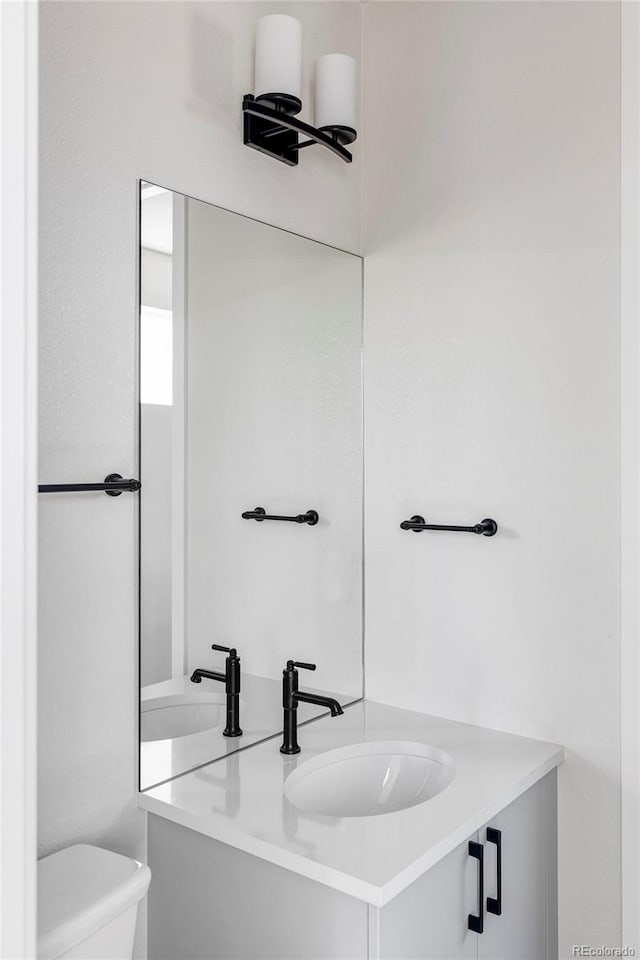 bathroom with vanity and toilet