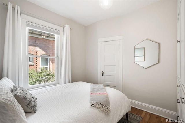 534 S Pearl St, Denver, CO 80209 - bedroom with wood finished floors and baseboards