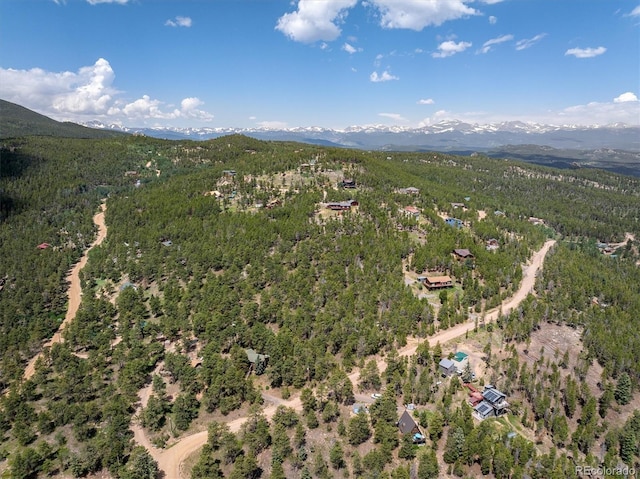 153 Divide View Dr, Golden, CO 80403 - view of property location with a mountain backdrop and a heavily wooded area