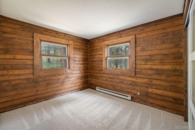 153 Divide View Dr, Golden, CO 80403 - spare room featuring a baseboard heating unit, carpet floors, and wooden walls