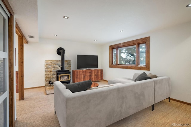 153 Divide View Dr, Golden, CO 80403 - living area with a wood stove, recessed lighting, and light carpet