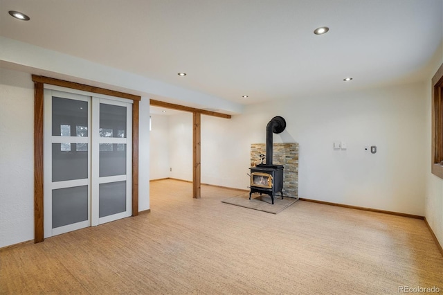 153 Divide View Dr, Golden, CO 80403 - unfurnished living room with recessed lighting and a wood stove