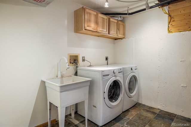 153 Divide View Dr, Golden, CO 80403 - laundry room featuring cabinet space, washing machine and dryer, and dark stone finish floors