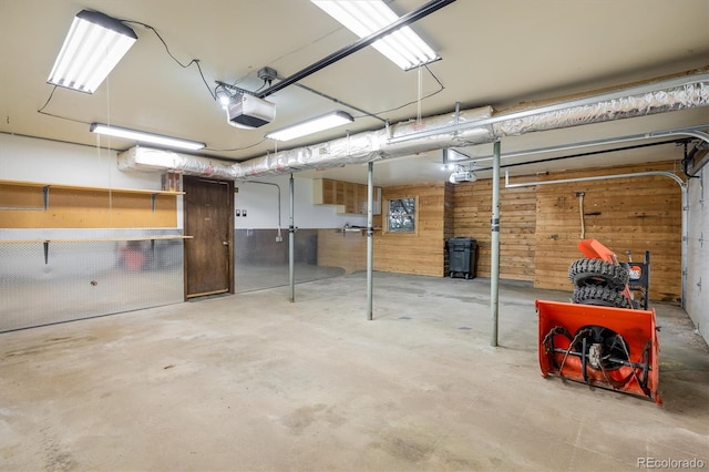 153 Divide View Dr, Golden, CO 80403 - garage with a garage door opener and wood walls