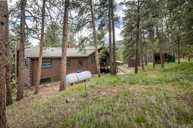 153 Divide View Dr, Golden, CO 80403 - back of house featuring roof with shingles, log exterior, and a wooden deck