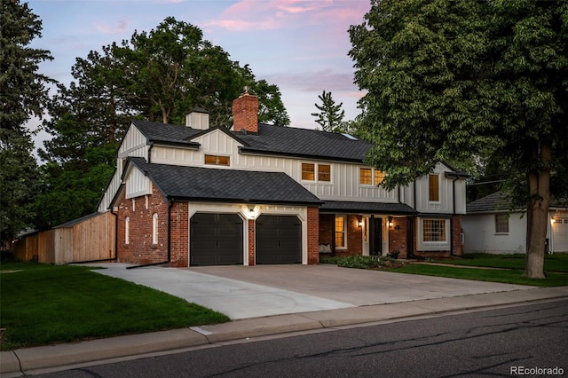 2684 Taft Ct, Lakewood, CO 80215 - view of front of property with a garage, a chimney, board and batten siding, concrete driveway, and a lawn