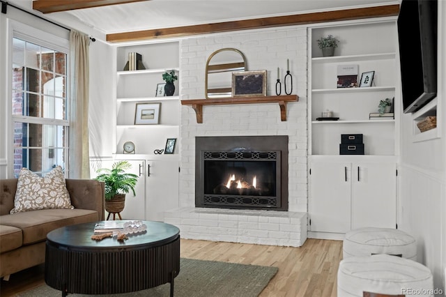 2684 Taft Ct, Lakewood, CO 80215 - living area featuring wood finished floors, a fireplace, and built in shelves