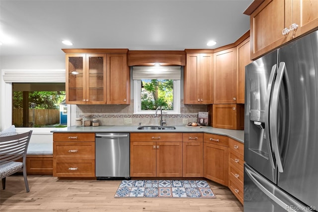 2684 Taft Ct, Lakewood, CO 80215 - kitchen with stainless steel appliances, a sink, healthy amount of natural light, tasteful backsplash, and recessed lighting
