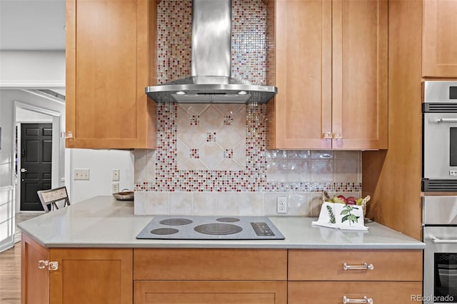 2684 Taft Ct, Lakewood, CO 80215 - kitchen with wall chimney range hood, electric cooktop, oven, and light countertops