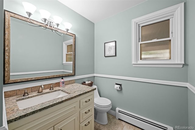 2684 Taft Ct, Lakewood, CO 80215 - half bath featuring a baseboard radiator, toilet, baseboards, vanity, and a chandelier