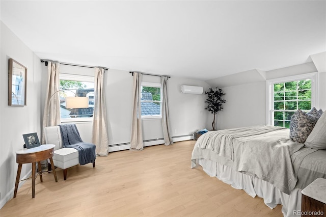 2684 Taft Ct, Lakewood, CO 80215 - bedroom featuring an AC wall unit and light wood-type flooring
