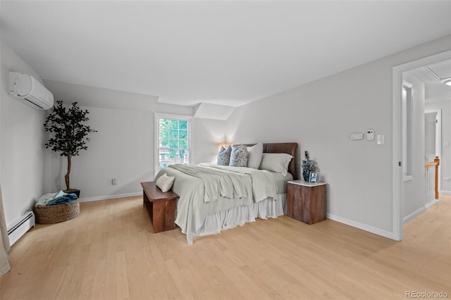 2684 Taft Ct, Lakewood, CO 80215 - bedroom with a wall mounted air conditioner, light wood-style flooring, a baseboard heating unit, baseboards, and attic access