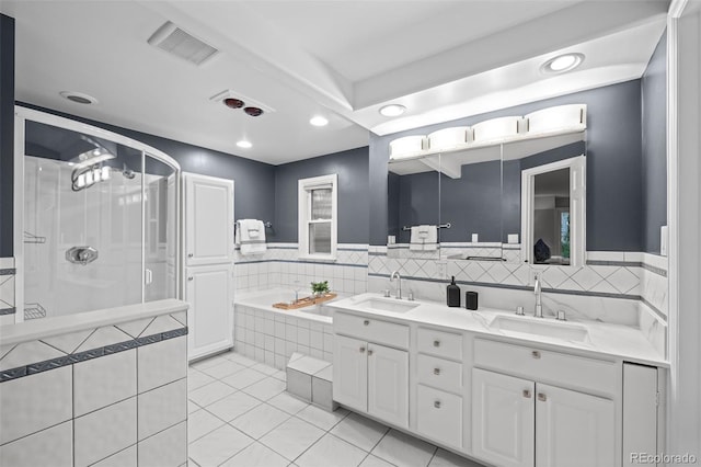 2684 Taft Ct, Lakewood, CO 80215 - full bath with a shower stall, tile patterned floors, double vanity, a bath, and tile walls