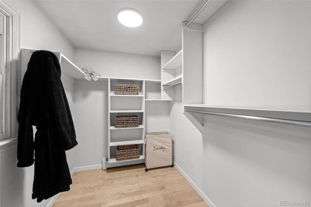 2684 Taft Ct, Lakewood, CO 80215 - spacious closet featuring wood finished floors