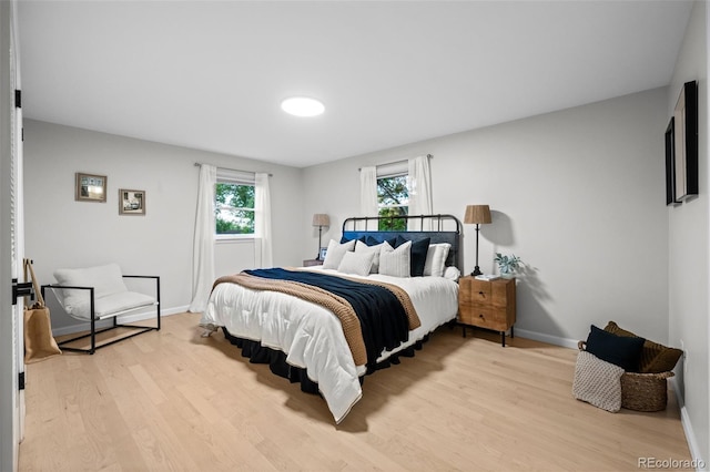 2684 Taft Ct, Lakewood, CO 80215 - bedroom featuring light wood finished floors, multiple windows, and baseboards
