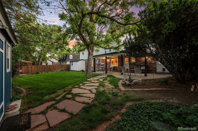 2684 Taft Ct, Lakewood, CO 80215 - yard at dusk with a patio area