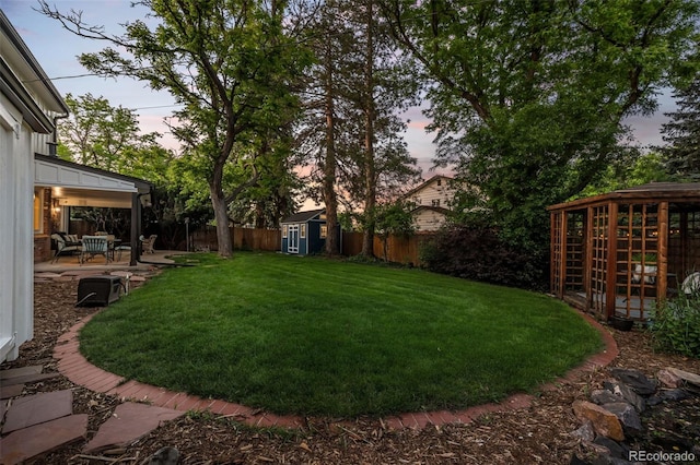 2684 Taft Ct, Lakewood, CO 80215 - yard at dusk featuring a patio