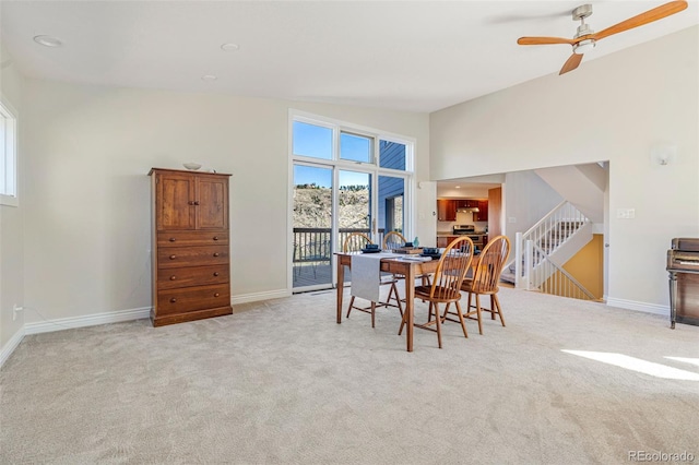 319 Camino Bosque, Boulder, CO 80302 - dining area featuring carpet flooring, a ceiling fan, and stairs