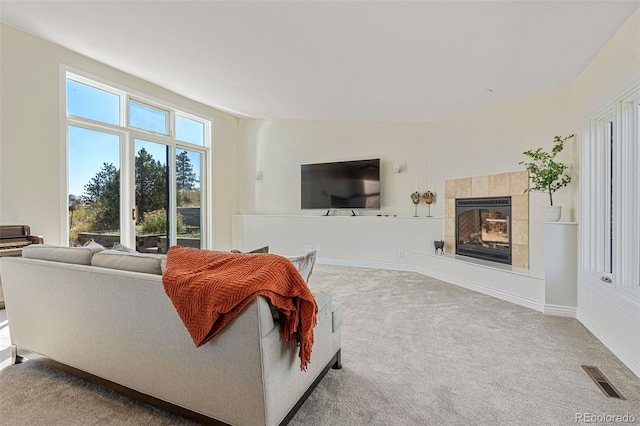 319 Camino Bosque, Boulder, CO 80302 - living room featuring carpet flooring and a tiled fireplace