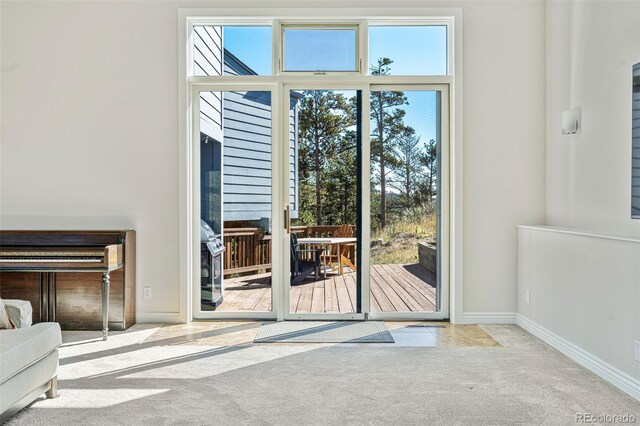 319 Camino Bosque, Boulder, CO 80302 - doorway to outside featuring carpet flooring and baseboards