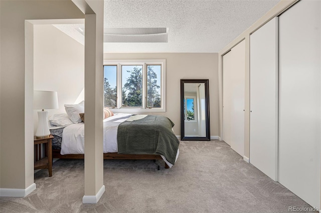 319 Camino Bosque, Boulder, CO 80302 - bedroom featuring light carpet and a textured ceiling