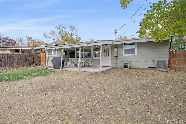 back of property featuring a patio, central AC unit, and fence