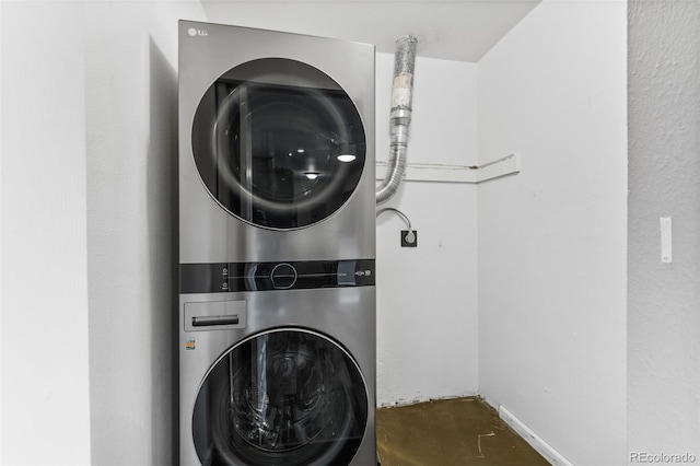 laundry area featuring stacked washer and dryer