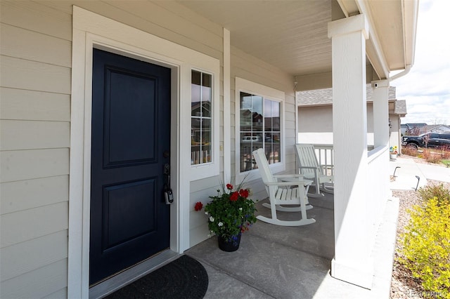 property entrance featuring a porch