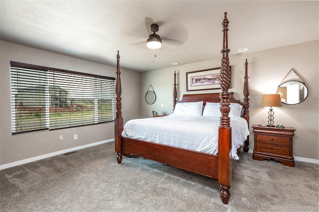 bedroom with carpet, visible vents, baseboards, and ceiling fan