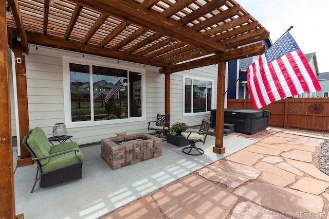 view of patio featuring a pergola, a hot tub, a fire pit, and fence